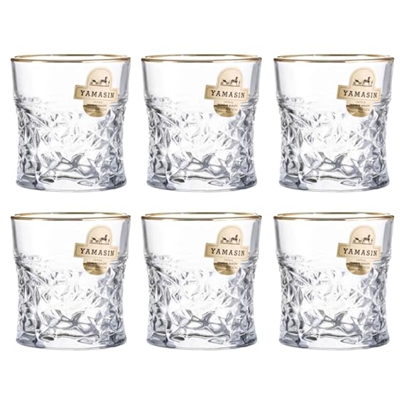 Set of six crystal glasses on a white background