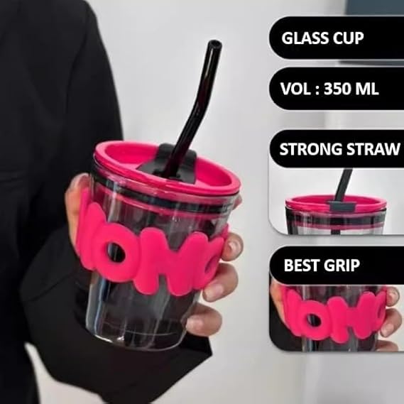 Clear glass cup with pink holder, black straw, and 'boba' branding held by a person.