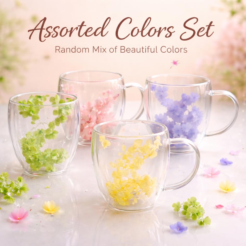 Clear glass mugs with colorful decorative elements on a light background