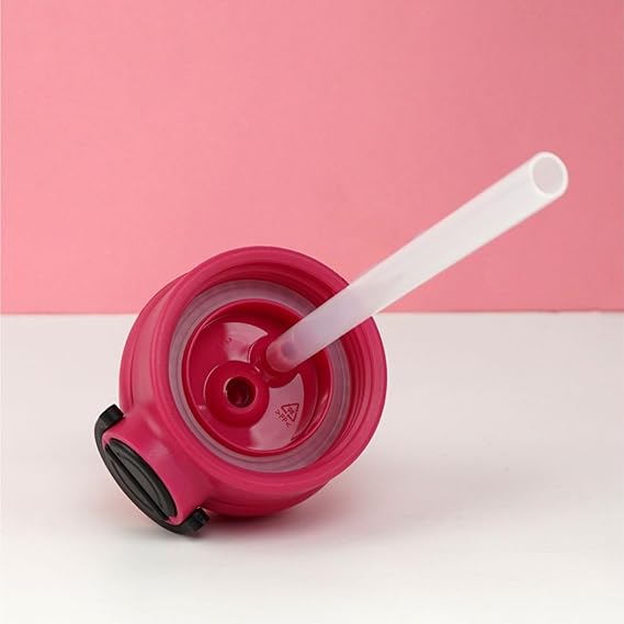 Pink drink container with a white straw on a pink background