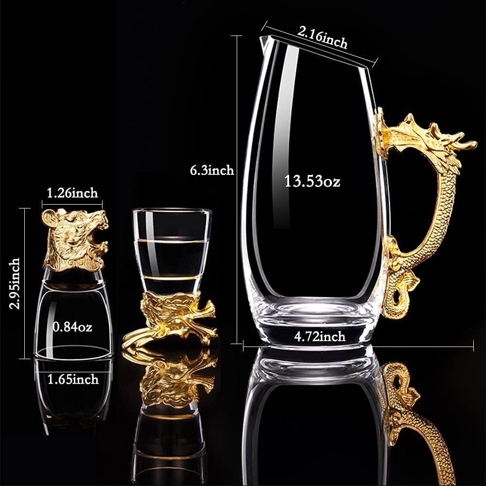 A clear glass carafe with a gold dragon handle, shown alongside a small matching glass and a larger tumbler, with overlaid dimension labels on a black reflective background.