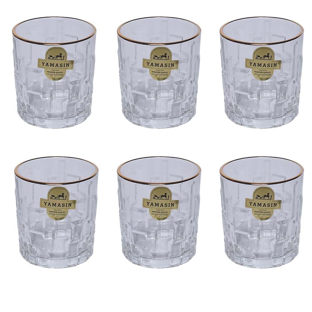 Six clear cut-glass tumblers arranged in two rows of three on a white background, each with a gold rim and a gold circular Yamasin label on the front.