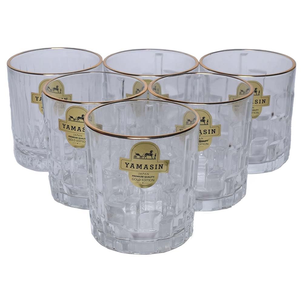 Five clear cut-glass tumblers with gold rims and gold Yamasin labels, arranged in a cluster on a white background.