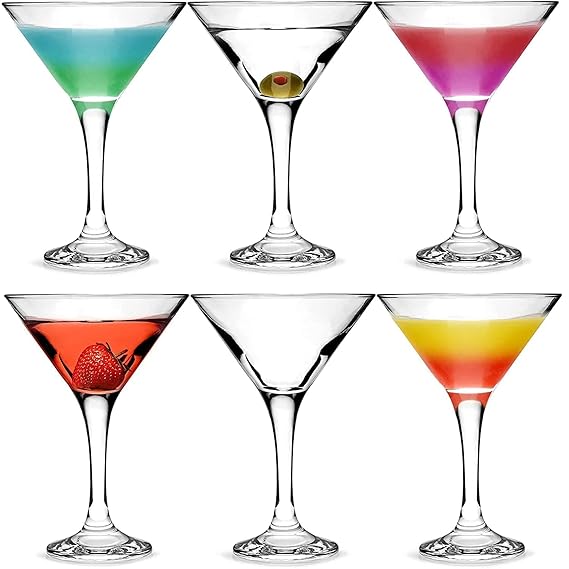 Set of six cocktail glasses with colorful drinks on a white background