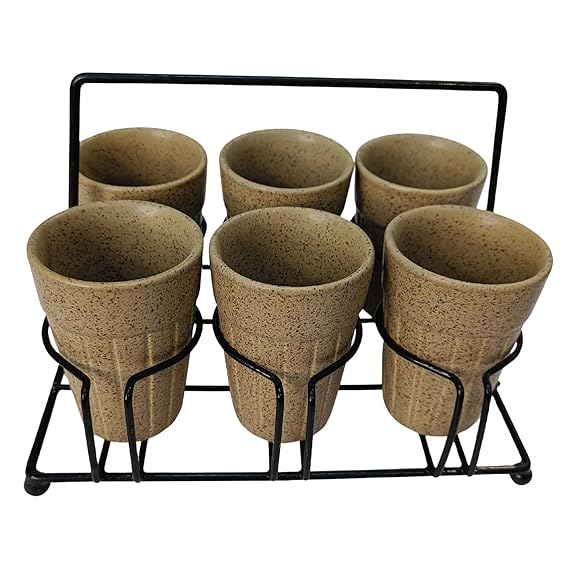 Set of six ceramic cups with a black metal stand on a white background