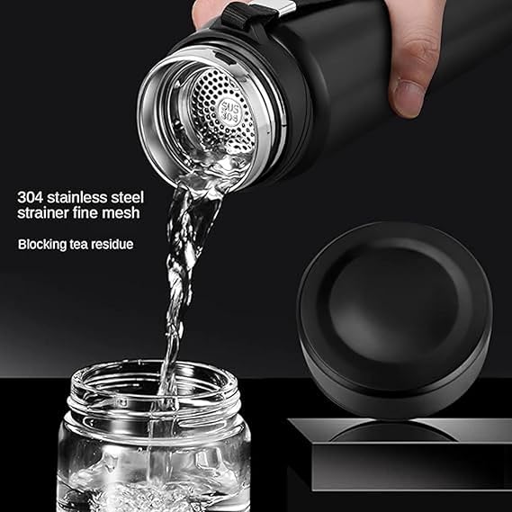 Black tea infuser with stainless steel strainer being used to pour water into a glass jar.