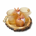 Golden Textured Glass Mug & Candle Set on Rustic Wood Tray - Perfect for cozy evenings or as an elegant gift. Handcrafted detailing and warm amber glow. Dailyalley